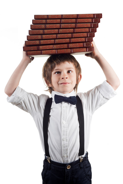 Niño y el peso de los libros
 - Foto, Imagen
