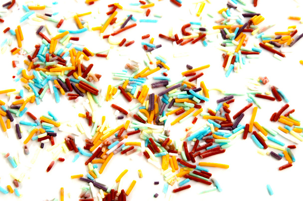 Colorido cupcake espolvorea sobre un fondo brillante
 - Foto, imagen