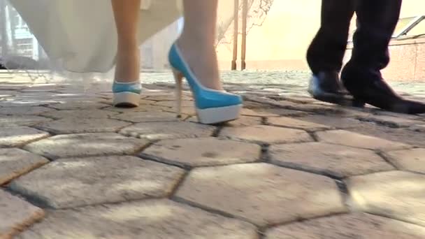 legs of bride and groom in the movement area - Filmati, video