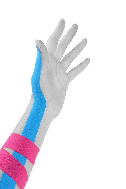 Kinesio tape on female hand. - Foto, afbeelding
