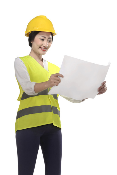 Asian businesswoman looking at blueprint - Photo, Image