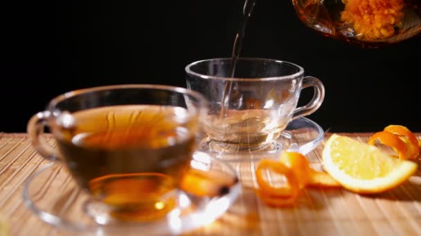Pouring Blooming Tea with Cinnamon and Orange 2 4K - Footage, Video