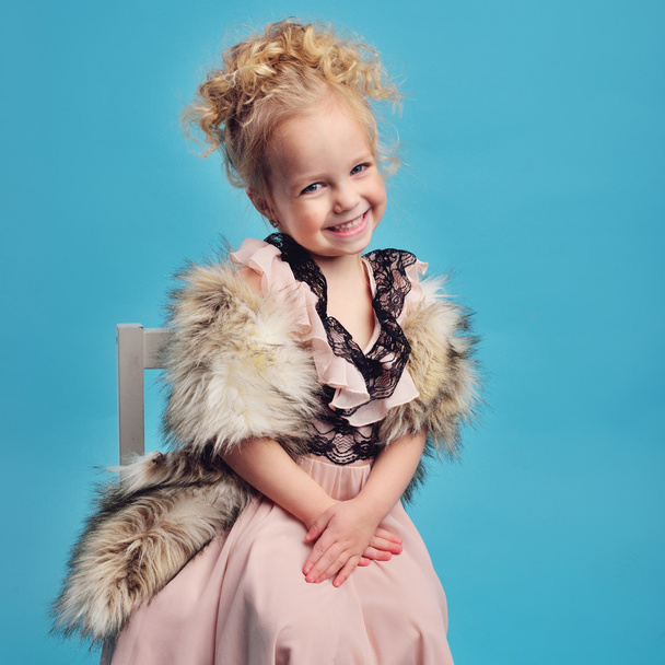 little girl in a long dress and a fur coat - Photo, Image