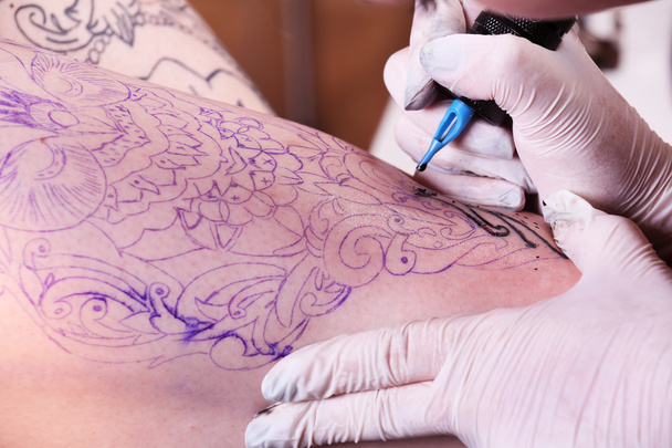 Process of making tattoo  - Foto, Bild