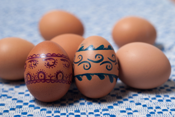 Colorful eggs on blue white towel - Photo, Image