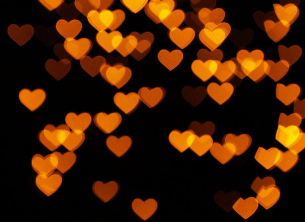 Many orange hearts on black - Foto, Imagem