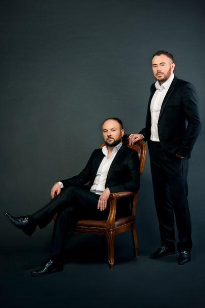 Portrait of two men in black suits - Φωτογραφία, εικόνα