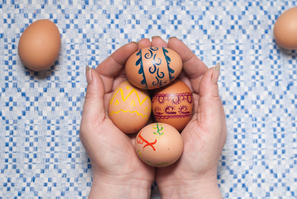 Painted eggs on hand - Photo, Image
