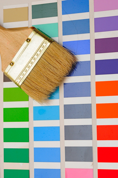 Palette of color samples with paintbrush on white background - Photo, Image