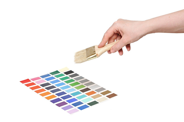 mano con pincel y coloridas muestras de pintura
 - Foto, Imagen