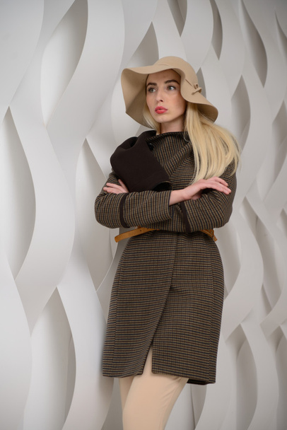 Girl in studio posing at coat - Valokuva, kuva