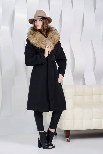 Girl in studio posing at coat - Foto, immagini