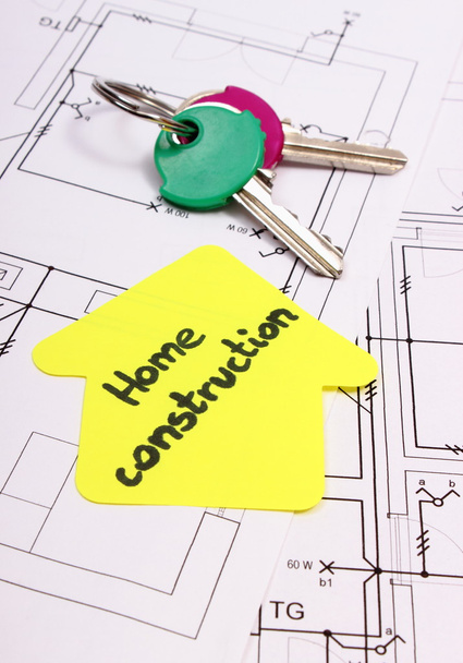 Sárga papír szöveg lakásépítés és kulcsok, konstrukciós rajz-ház - Fotó, kép