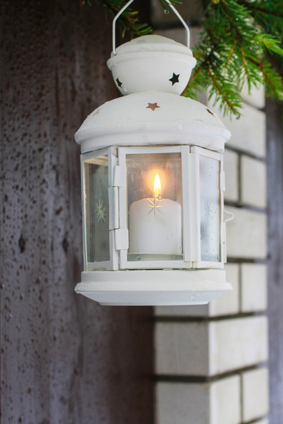White lantern hanging on a fir branch. - Photo, Image