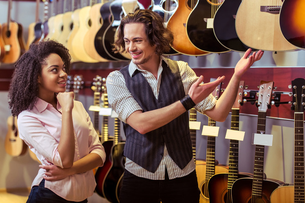 People in musical shop - Photo, Image