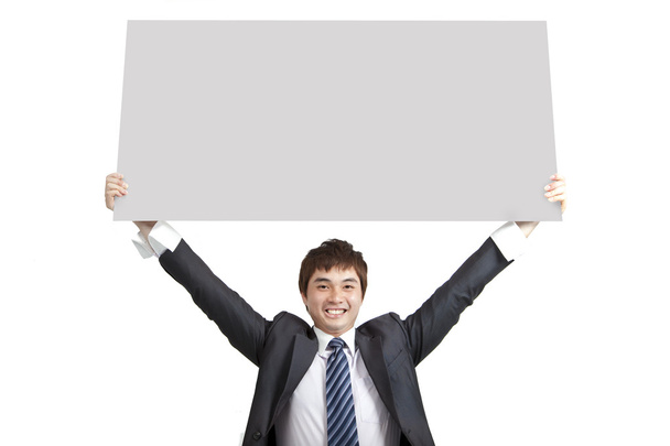 Young business man holding board - Photo, Image