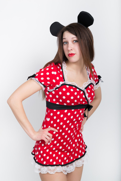 close-up beautiful young leggy brunette in a very short red dress with white polka dots - Foto, imagen