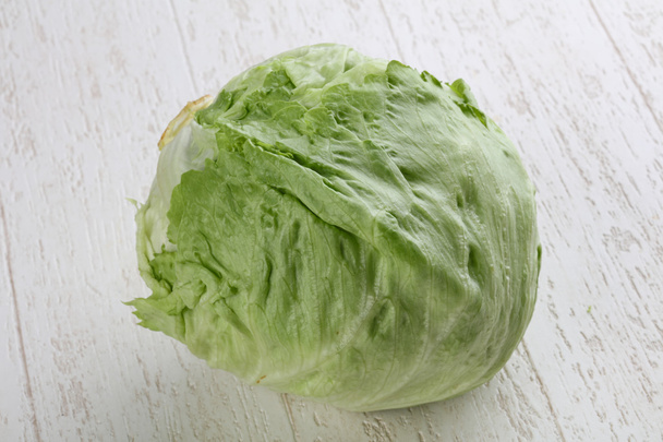 Fresh Iceberg salad on wood - Фото, изображение