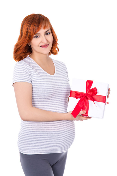 happy young pretty pregnant woman with gift box isolated on whit - Zdjęcie, obraz