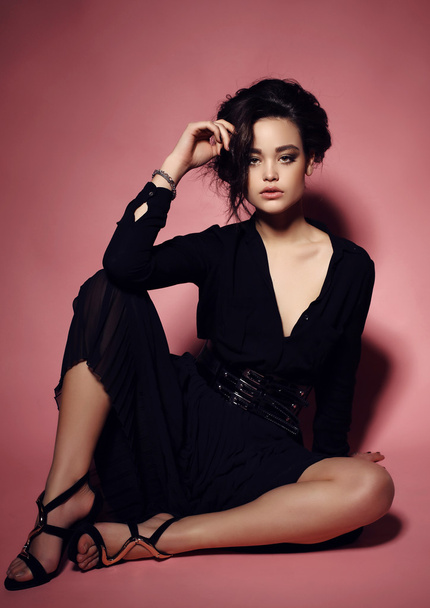 young woman with dark hair and evening makeup, in elegant clothes - Foto, immagini