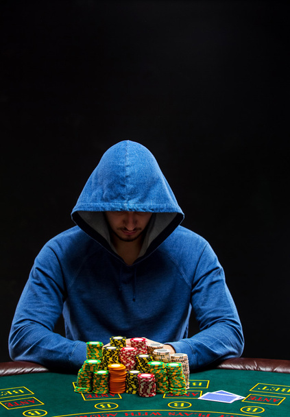 Poker player taking poker chips after winning - Photo, Image