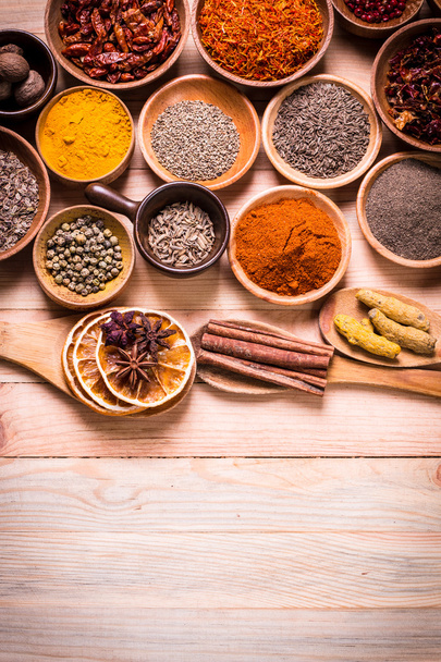 spices and herbs on wooden table. - Foto, imagen