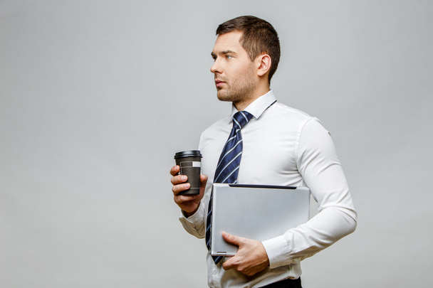 Handsome stylish businessman on grey background - Zdjęcie, obraz