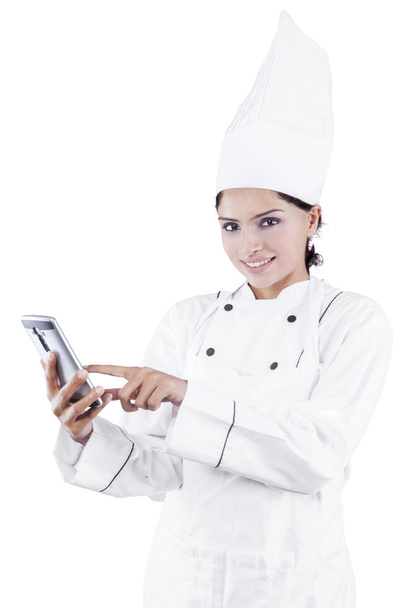 Female chef using smartphone - 写真・画像