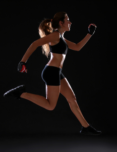 Fitness. Young woman doing exercise - Foto, Imagen