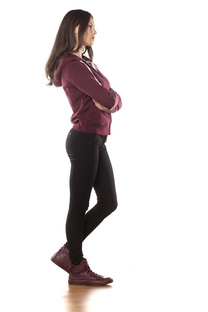 woman wearing tracksuit pants and hoodie - Фото, изображение