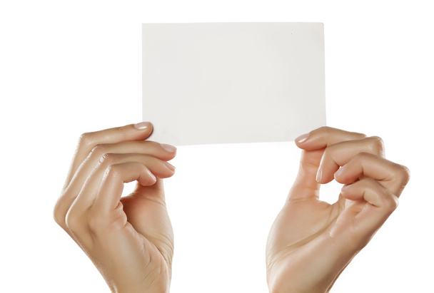 Mani con un foglio di carta bianco
 - Foto, immagini