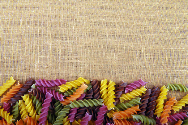 Colorful noodles on beige background - Photo, Image