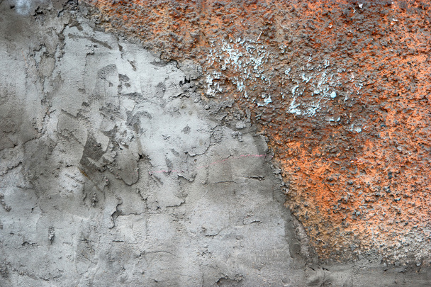 Half covered with plaster, half concrete wall - Фото, изображение