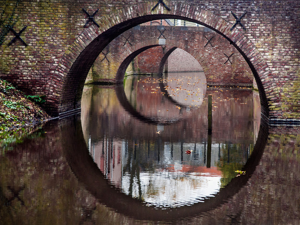 Reflection of the bridges in water of a canal - Photo, Image