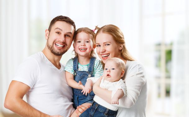 happy family mother, father and children at home - Фото, зображення