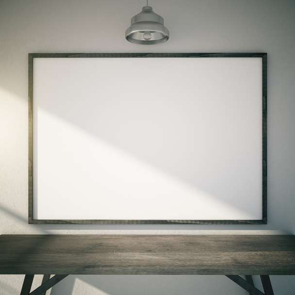 Blank picture frame with sunlight above wooden table and lamp, m - Foto, Imagem