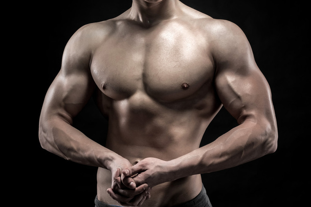 Close-up of man model torso posing showing perfect body - Fotó, kép