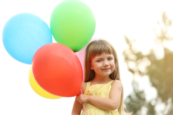 Little girl with balloons   - Zdjęcie, obraz