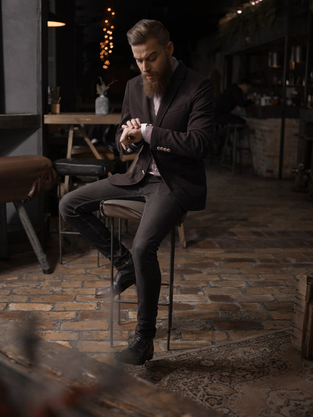 Attractive man with beard is very busy - Photo, Image