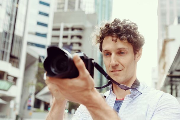 Male photographer taking picture - Valokuva, kuva