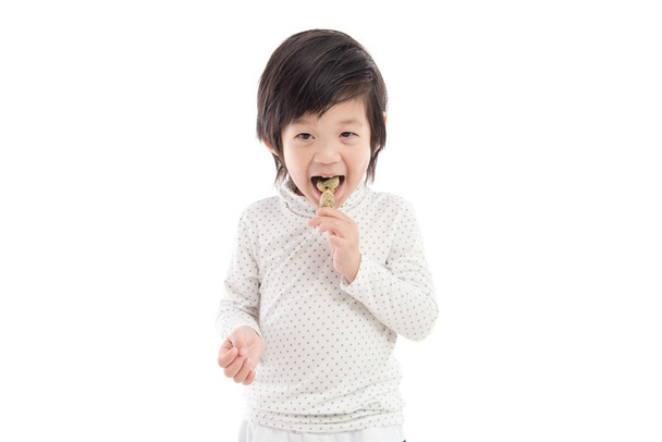 Leuke Aziatische kind eten Japanse dessert - Foto, afbeelding