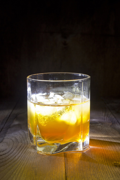 Glass of whiskey with ice - Фото, изображение