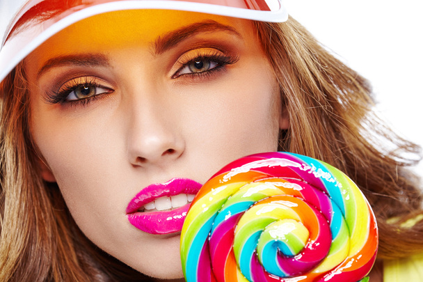 beautiful woman eating lollipop - Fotoğraf, Görsel