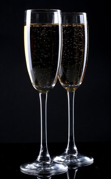 Two glasses of champagne on black background - Photo, Image