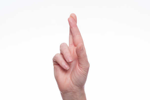 指を交差を女性の手 - 写真・画像