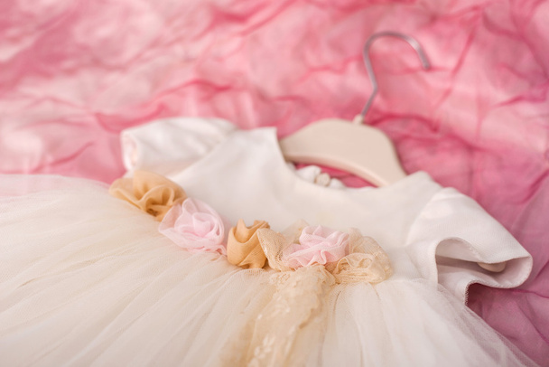 christening baby's dress hanging on a hanger - Photo, image