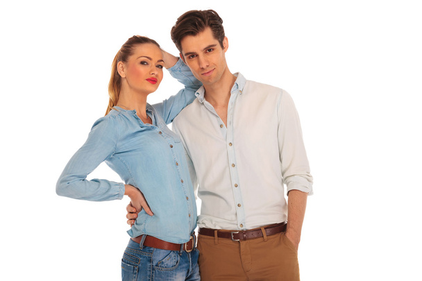 man with hand in pocket holding girlfriend - Foto, afbeelding