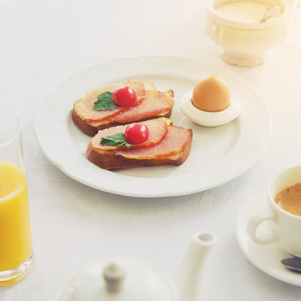 Traditional Hotel Breakfast with coffee, ham toasts and egg - Photo, Image