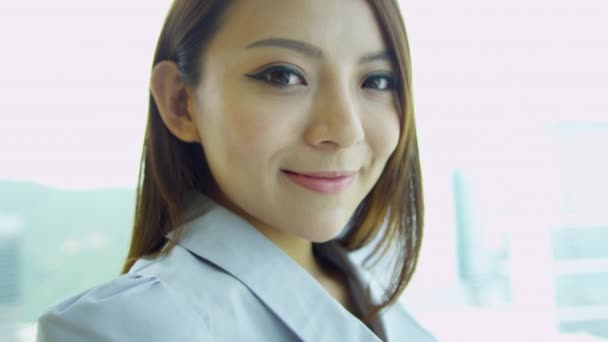 female Chinese financial consultant smiling to camera  - Footage, Video