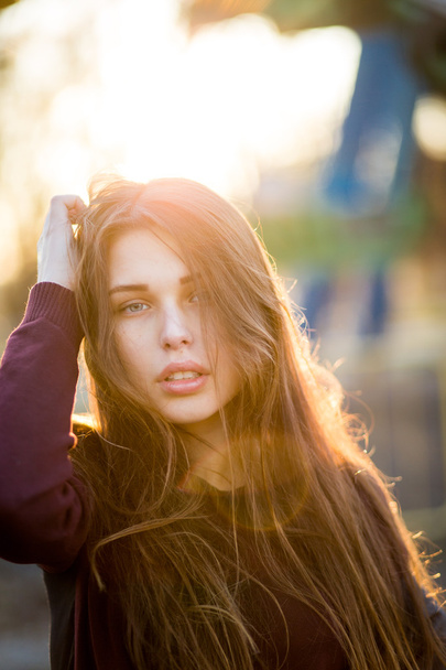 Portrait of beautiful young brunette girl in the Park - Fotografie, Obrázek